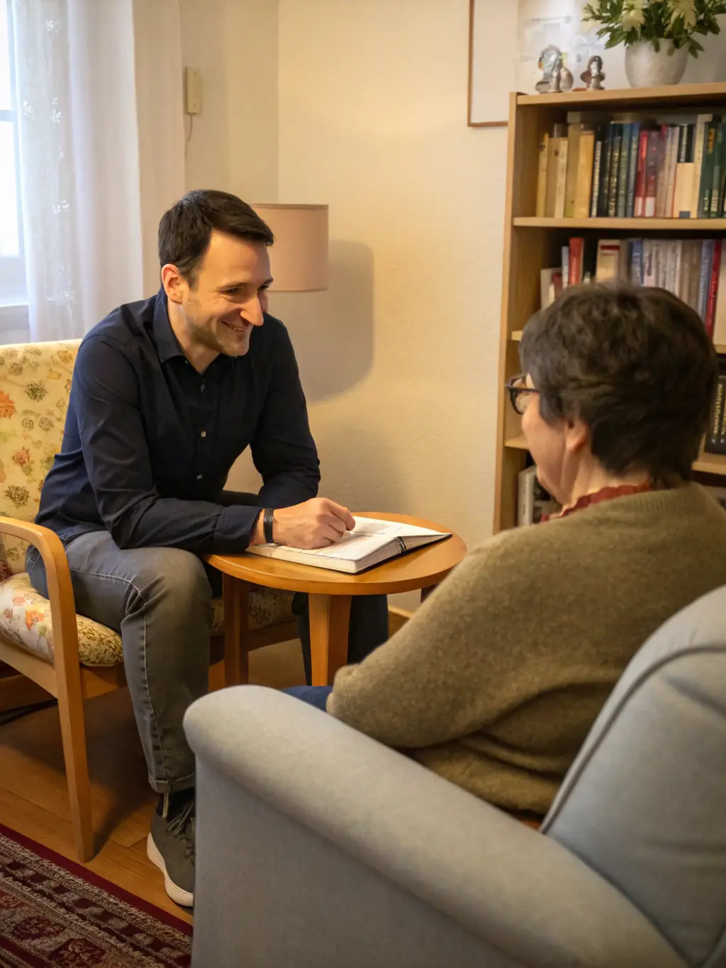 An image of a coach and client engaged in a focused one-on-one session, with notes and a laptop on the table, representing One-on-One Business Coaching.